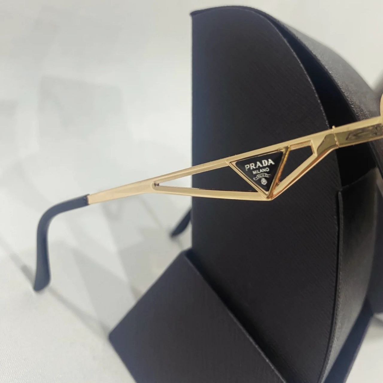 PRADA GOLD SUNGLASSES